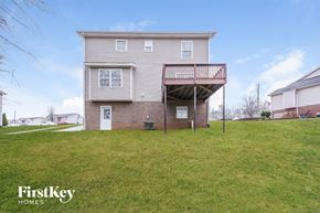Clarksville house for rent - A two-story building with a balcony on the second floor.