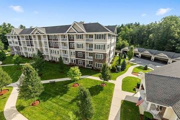 Salem apartment for rent - an aerial view of an apartment building with lawns and trees