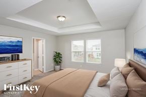 San Antonio house for rent - A bedroom with a bed, dresser, and a painting on the wall.