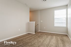 Wimauma house for rent - an empty room with carpet and a window