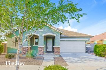 Queen Creek house for rent - a blue house with a white door and a tree