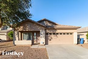 Avondale house for rent - A house with a brown roof and a garage door is shown.