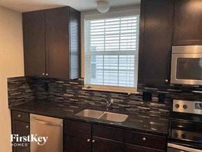 Columbus house for rent - a kitchen with a sink and a microwave