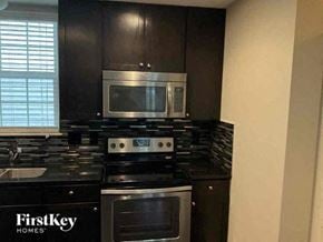 Columbus house for rent - a kitchen with a stove and a microwave