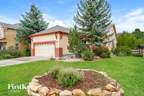 Peyton house for rent - a round rock retaining wall in front of a house