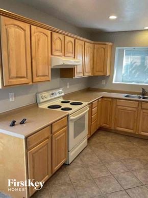 Glendale house for rent - a kitchen with wooden cabinets and a white stove top oven