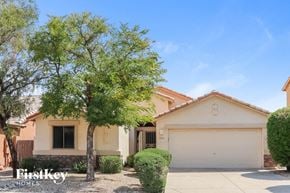 Phoenix house for rent - a house with a tree in front of it