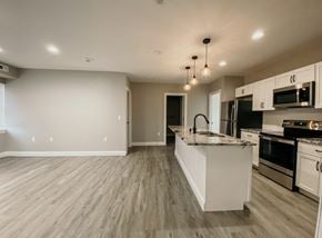 Tonawanda apartment for rent - an empty kitchen with a marble counter top
