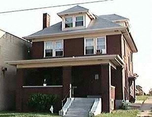Homestead apartment for rent - A two-story house with a garage on the first floor.