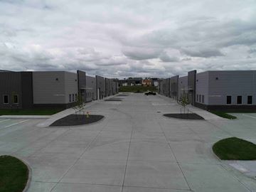 Elkhorn apartment for rent - an empty parking lot with rows of buildings