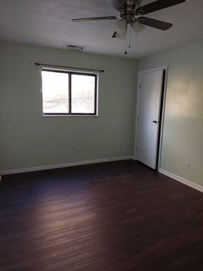 West Chester Township house for rent - A room with a ceiling fan and a window.