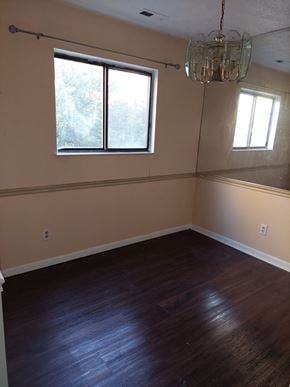 West Chester Township house for rent - A room with wooden floors and a chandelier.