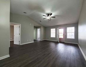 Moultrie apartment for rent - an empty living room with a ceiling fan