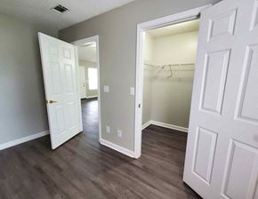 Moultrie apartment for rent - a living room with wood floors and a closet