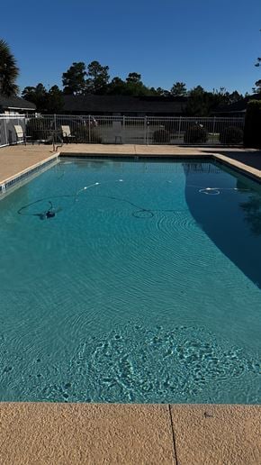 Moultrie apartment for rent - A swimming pool with a clear blue water and a brownish floor.