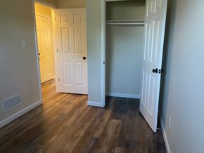 Columbus apartment for rent - a living room with wood flooring and a door to a closet