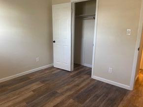 Columbus apartment for rent - a bedroom with wood flooring and a closet