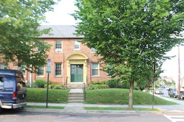Washington apartment for rent - A tree is in front of a house.