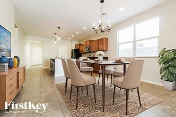 Buckeye house for rent - A dining room with a table set for six.
