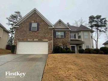 Buford house for rent - a brick house with a white garage door