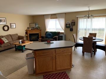 Eau Claire apartment for rent - a dining room and living room with a table and chairs