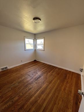 Milwaukee apartment for rent - the living room of an empty house with wood floors