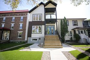 Regina apartment for rent - the front of a house with stairs and a yard
