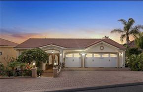 Santa Ana apartment for rent - a house with a driveway and a garage door