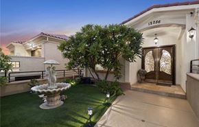 Santa Ana apartment for rent - a mansion with a courtyard and a fountain in front of it