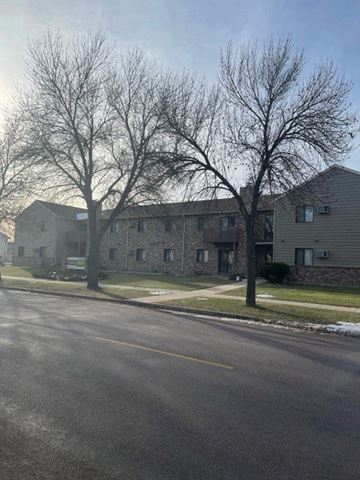 Fargo apartment for rent - a large apartment building on the side of a street