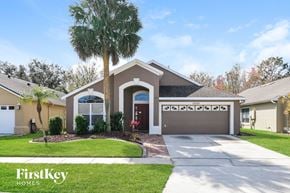 Orlando house for rent - a house with a palm tree in front of it