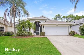 Haines City house for rent - A house with a garage and a driveway is for sale.