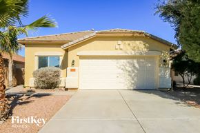 San Tan Valley house for rent - A house with a white garage door and a brown roof.