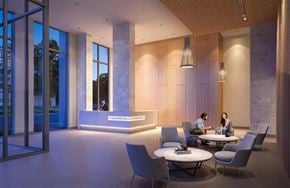 Burnaby apartment for rent - Two people sitting at a table in a modern lounge area.