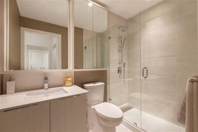Burnaby apartment for rent - A bathroom with a toilet, sink, and shower.