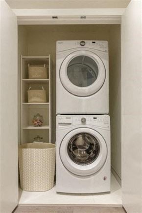 Burnaby apartment for rent - A white washing machine and dryer in a small laundry room.