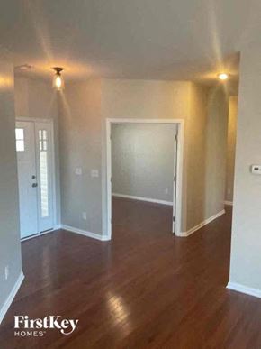 Huntersville house for rent - an empty living room with a hard wood floor