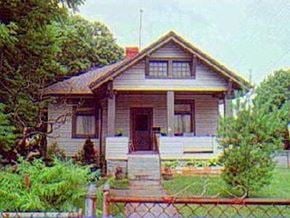 Cincinnati house for rent - a small house with a fence in front of it