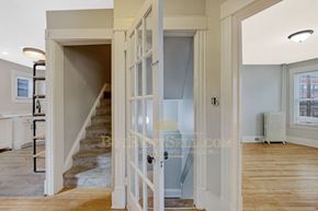 Minneapolis apartment for rent - a renovated house with a staircase and an open door