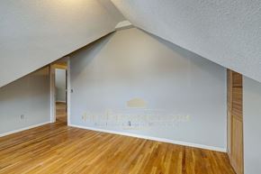 Minneapolis apartment for rent - a living room with wood floors and a white wall