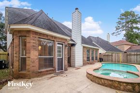 Humble house for rent - a backyard with a pool and a small brick house