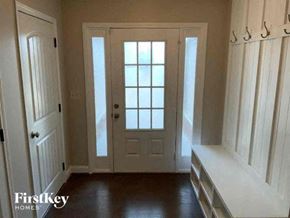 Jefferson house for rent - an empty room with a white door and a window