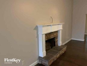 Jefferson house for rent - a living room with a fireplace and a hard wood floor