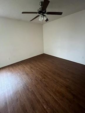 Killeen apartment for rent - an empty room with a ceiling fan and wood floors