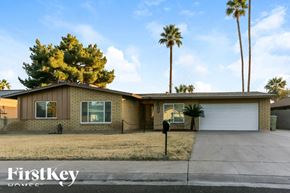 Glendale house for rent - A house with a palm tree in front of it.