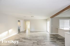 Glendale house for rent - A spacious room with a tiled floor and white walls.