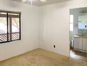 Show Low house for rent - A room with a sliding glass door and a ceiling fan.
