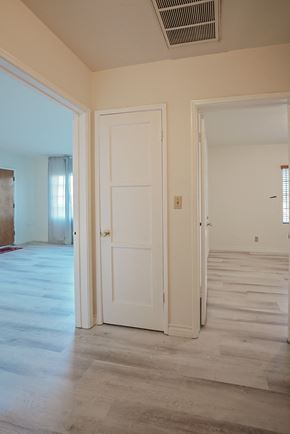 Monterey Park apartment for rent - a view of the living room from the hallway with the door open to the bedroom