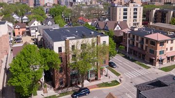 Madison apartment for rent - A car is parked on the side of the road.