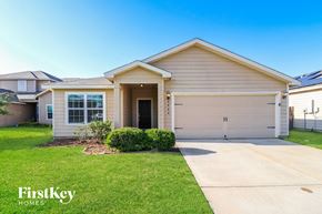 Brookshire house for rent - A house with a garage and a driveway is for sale by FirstKey Homes.